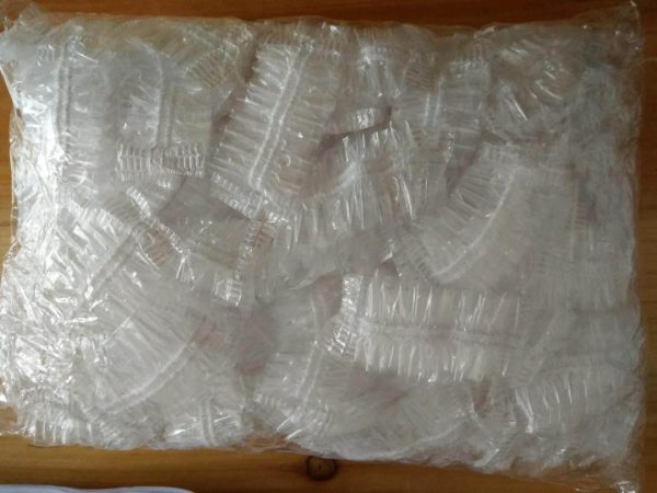 Plastic Disposable Shower Caps. 100 pieces.